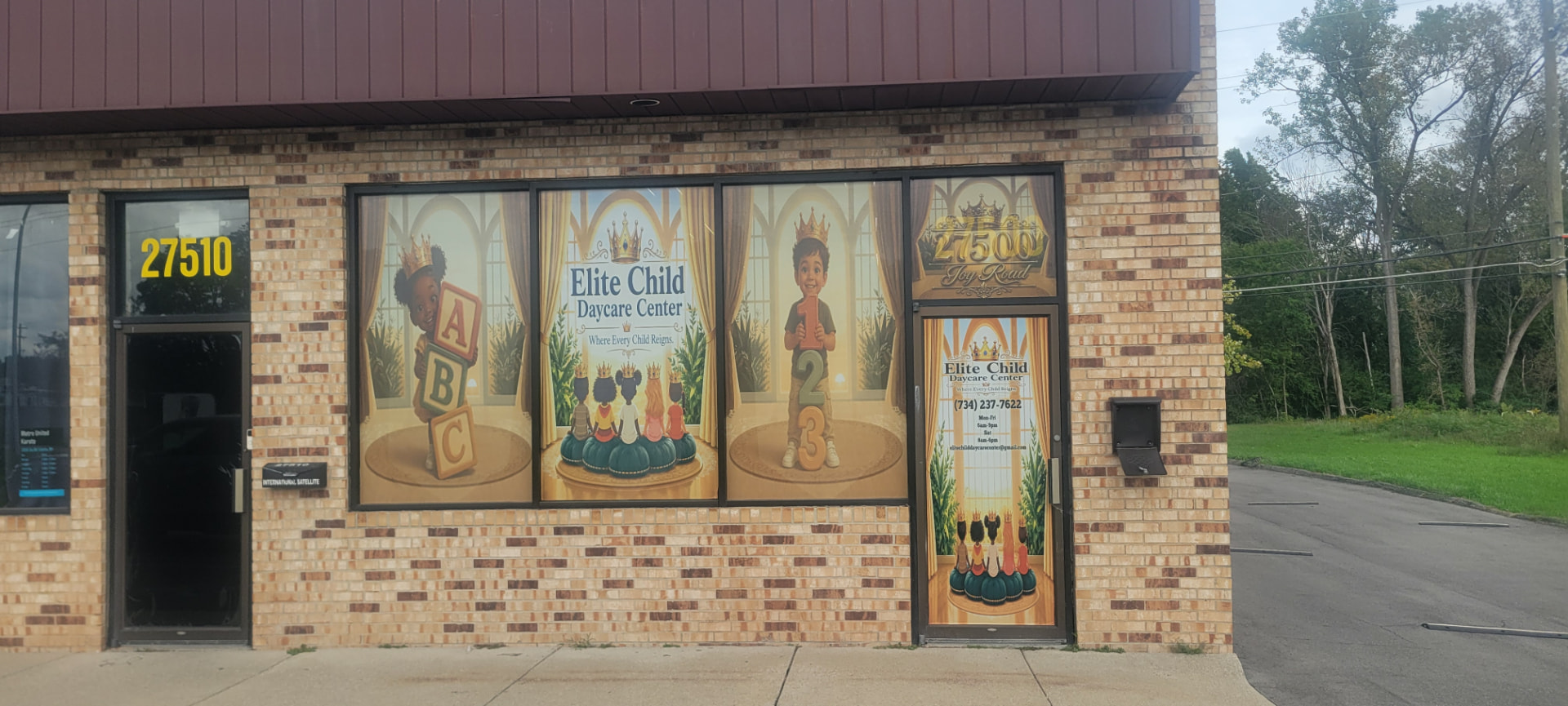 Elite Child Daycare Center storefront with gold crown window artwork